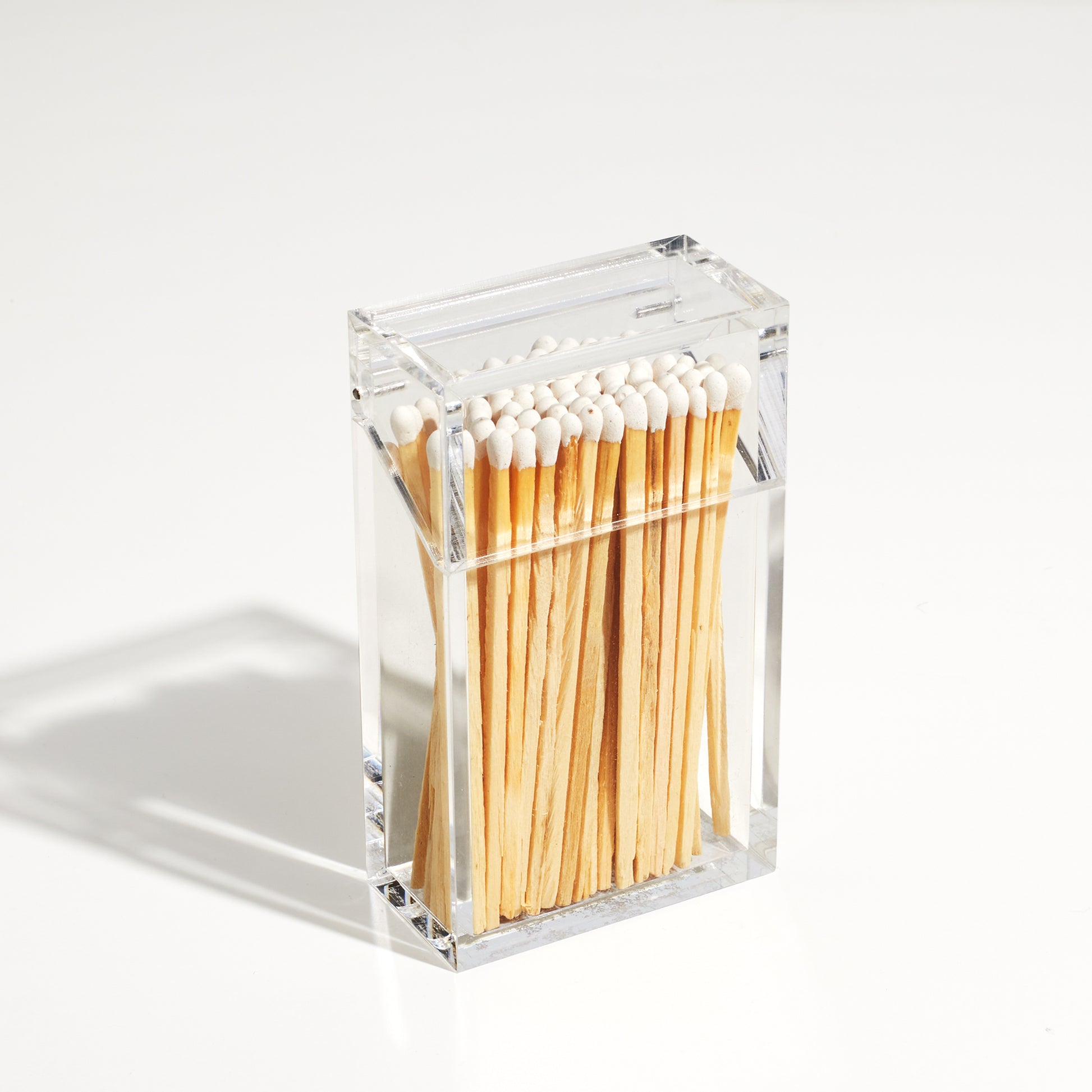 Match holder shaped like a Cigarette style acrylic case with matches in it.