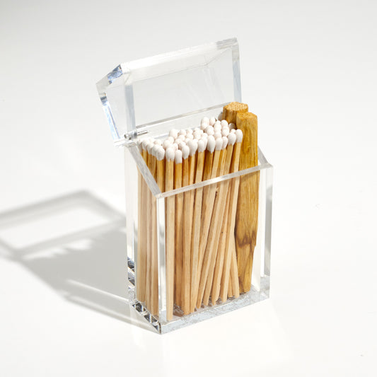Cigarette style acrylic case with white matches and palo santo in it. 