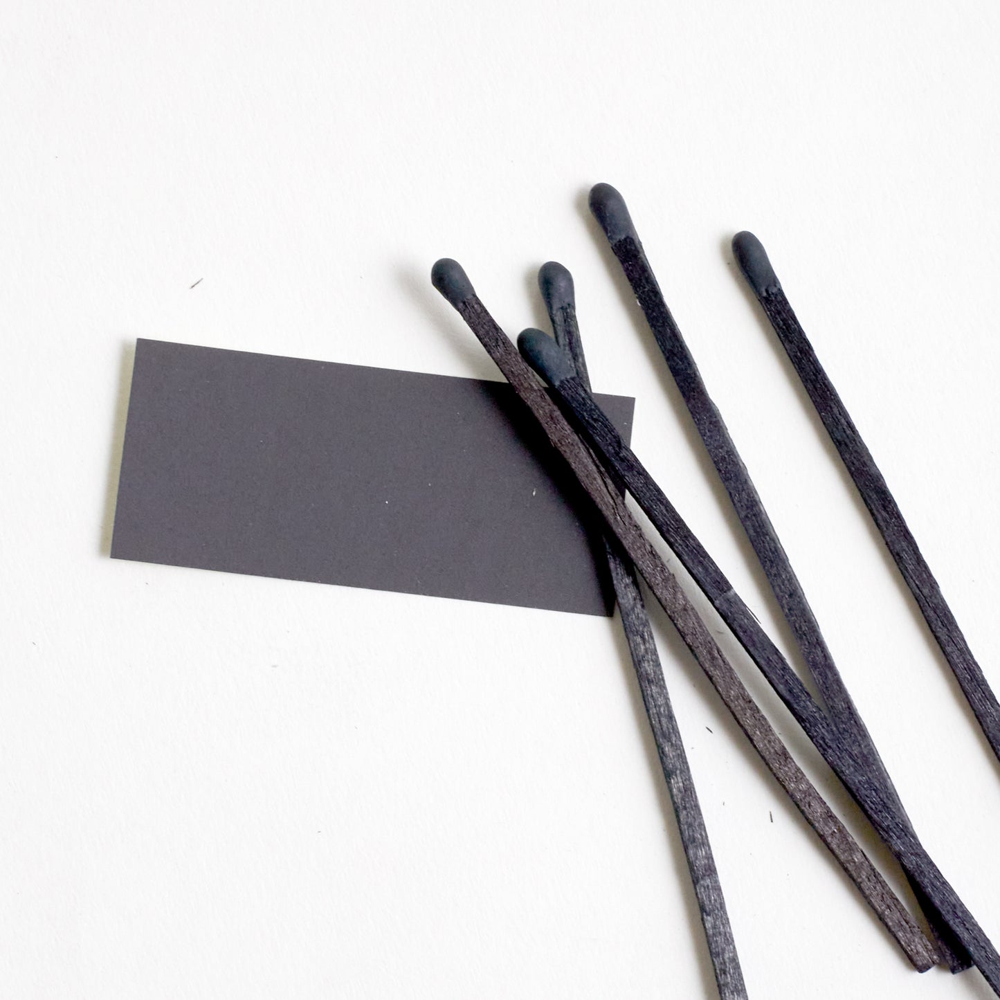CLOSE UP OF THE STRIKER STICKER AND BLACK MATCHES.