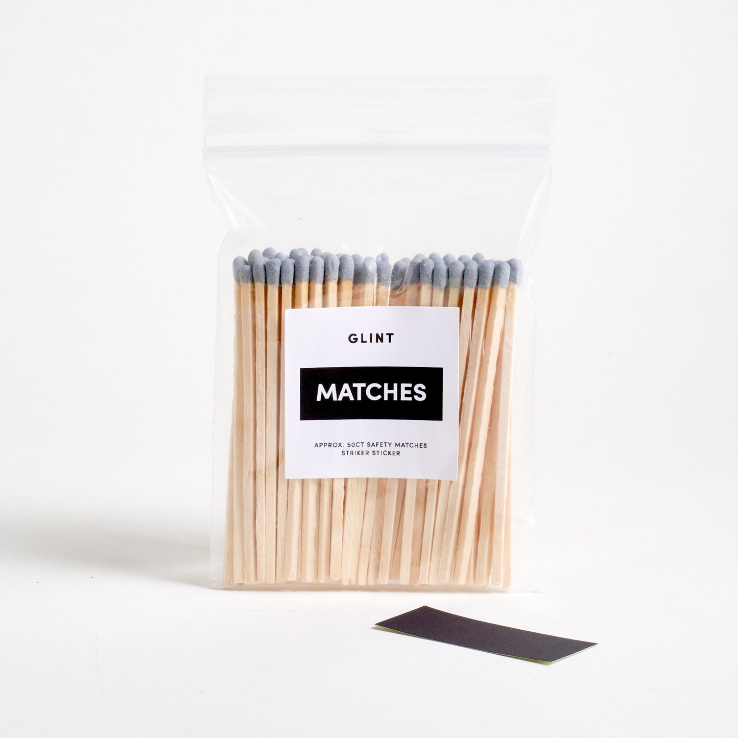 GRAY 4 IN SAFTY MATCHES IN A ZIPLOCK BAG WITH A STRIKER PAPER STICKER ON THE SIDE.