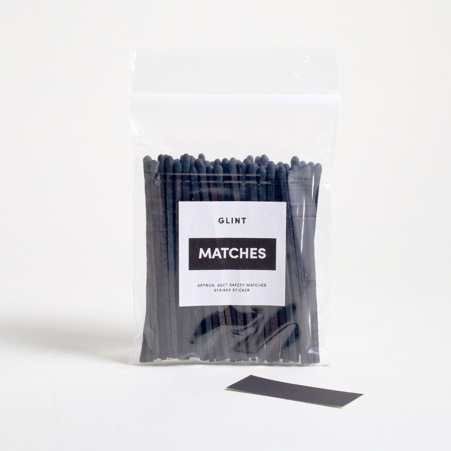 BLACK 4 IN SAFTY MATCHES IN A ZIPLOCK BAG WITH A STRIKER PAPER STICKER ON THE SIDE.