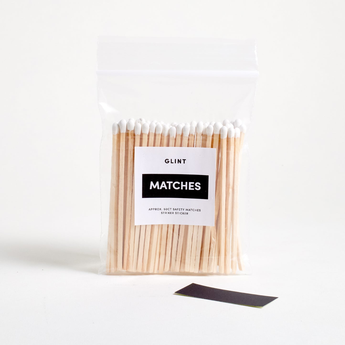 WHITE 4 IN SAFTY MATCHES IN A ZIPLOCK BAG WITH A STRIKER PAPER STICKER ON THE SIDE.