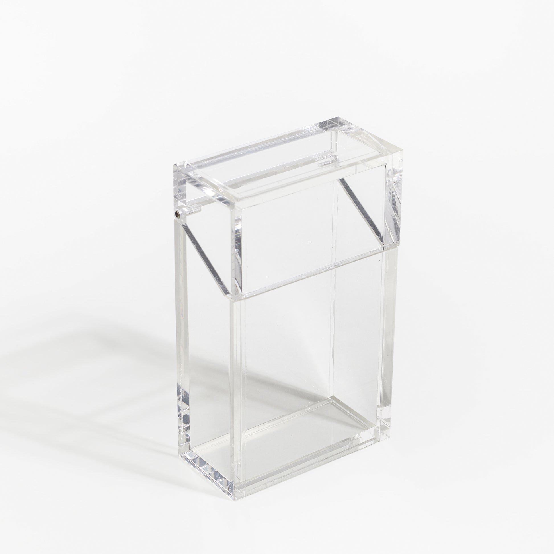 ACRYLIC CASE SHAPED LIKED A CIGARETTE CASE.